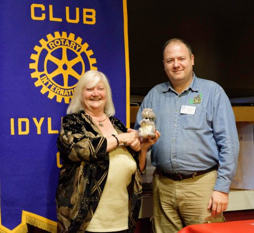 Reverend Shelly Downes, founder of the Spiritual Oneness Center, displays the Idyllwild Rotary squirrel she received from Rotary President Marc Kassouf at the weekly Idyllwild Rotary meeting on Wednesday, Sept. 14. Downes informed Rotary members about the history and programs offered at the non-denominational facility, located on Cedar Street.  Photo by Tom Kluzak