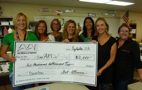 Members of Idyllwild School smARTS accept a $2,000 donation from the Art Alliance of Idyllwild.  Money will be used for art supplies and teacher stipends. From left, Ginger Dagnall, Stacy Oates, Susan Gray, Saffron Symank, Catherine Smith, Christine Hunt and Samantha Mason.