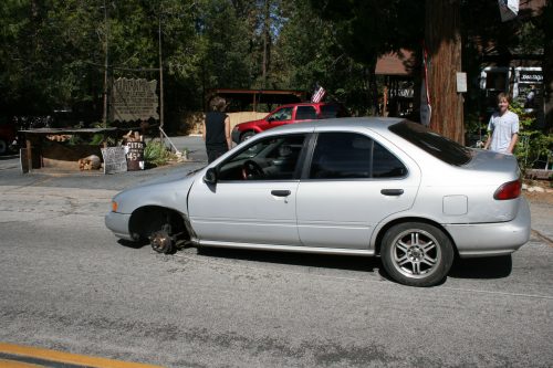 When things go wrong they really go wrong. Leo Blair, 19, and friend Todd Wood were taking Leo’s grandmother’s car to Idyllwild Garage for an alignment problem. They were on North Circle just up from the Rustic, when the lug nuts came off the front driver’s side wheel. The wheel came off and kept rolling nearly to the intersection with Highway 243 when a passerby stopped it with his foot. Photo by Marshall Smith