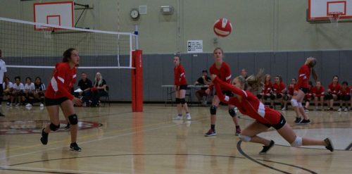 The Idyllwild Girls volleyball team defeated the California Military Institute on plays such as Kayli Lynn stretching far for the dig. Her teammates are (from left) Payton Priefer, Brooke Taylor, Emma Righetti and Emma Crump. Photo by Chandra Lynn 