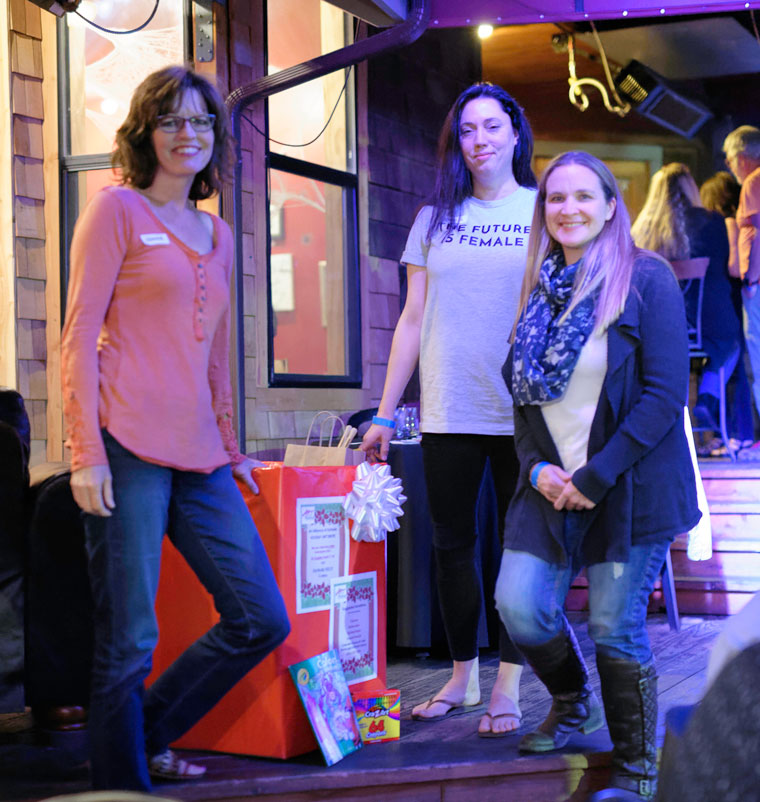 Shanna Robb (left), president of the Art Alliance of Idyllwild, welcomes Skye Zambrana (center) and Colleen Meyer of the Idyllwild HELP Center to the Art Alliance Member Mingle on Thursday, Oct. 20, at Café Aroma. Art Alliance members brought art materials to donate to the HELP Center so they can be distributed to children in need over the holiday season. Boxes to receive more donations will be located at Café Aroma and the Idyllwild Library through the end of October, where even a small donation will help encourage the creativity of Idyllwild children and make their holidays a little brighter. Photo by Tom Kluzak