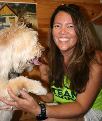 Pine Cove resident and marathon runner Laura Caster is pictured here with her physical therapist and training partner Ella.Photo by Marshall Smith