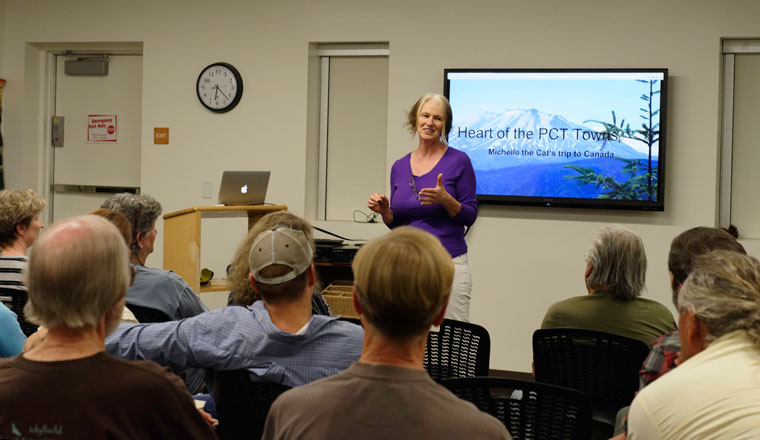 Julie Pendray, a journalist, gave a presentation about restocking towns along the Pacific Crest Trail at the Idyllwild Library on Tuesday evening, Oct. 18. She did extensive personal research into the towns that serve as supply depots for hikers, including Idyllwild, driving along the trail with her cat, Michelle. The room was crowded with past and future PCT hikers. Photo by Tom Kluzak 