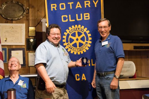 Idyllwild Rotary member John Graham (left) receives an official mug from President-elect Roland Gaebert at the weekly Rotary meeting on Oct. 12. Graham spoke to the club about his 38-year experience as a teacher of disabled high school students. Photo by Tom Kluzak