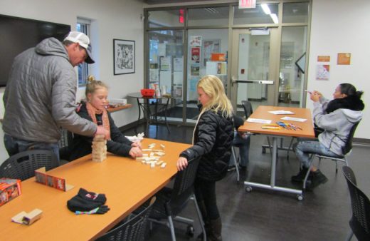 Cannon Shockley from Leadville, Colorado, plays games with Emma and Rylan Righetti at Game Day at the Idyllwild Library before the annual Tree Lighting on Saturday. Photo by Amy Righetti 