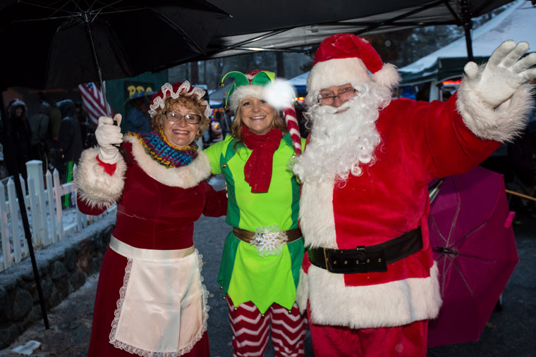 Santa Claus (Joe McNabb) and Mrs. Claus (Emily Pearson) brought an elf (Martha Johnston) to the Christmas Tree Lighting.