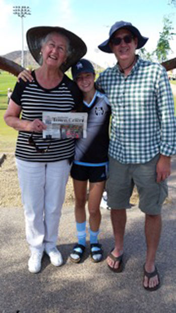 Nancy Borchers, son Jake and granddaughter Abby take time out from Abby’s ECNL soccer tournament in Phoenix to enjoy the Town Crier. Photo courtesy Nancy Borchers 