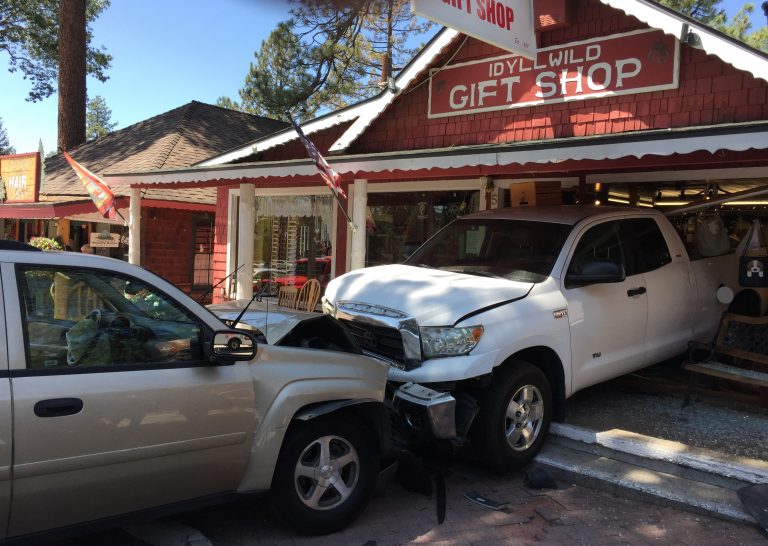 Traffic collision pushes parked truck into Gift Shop