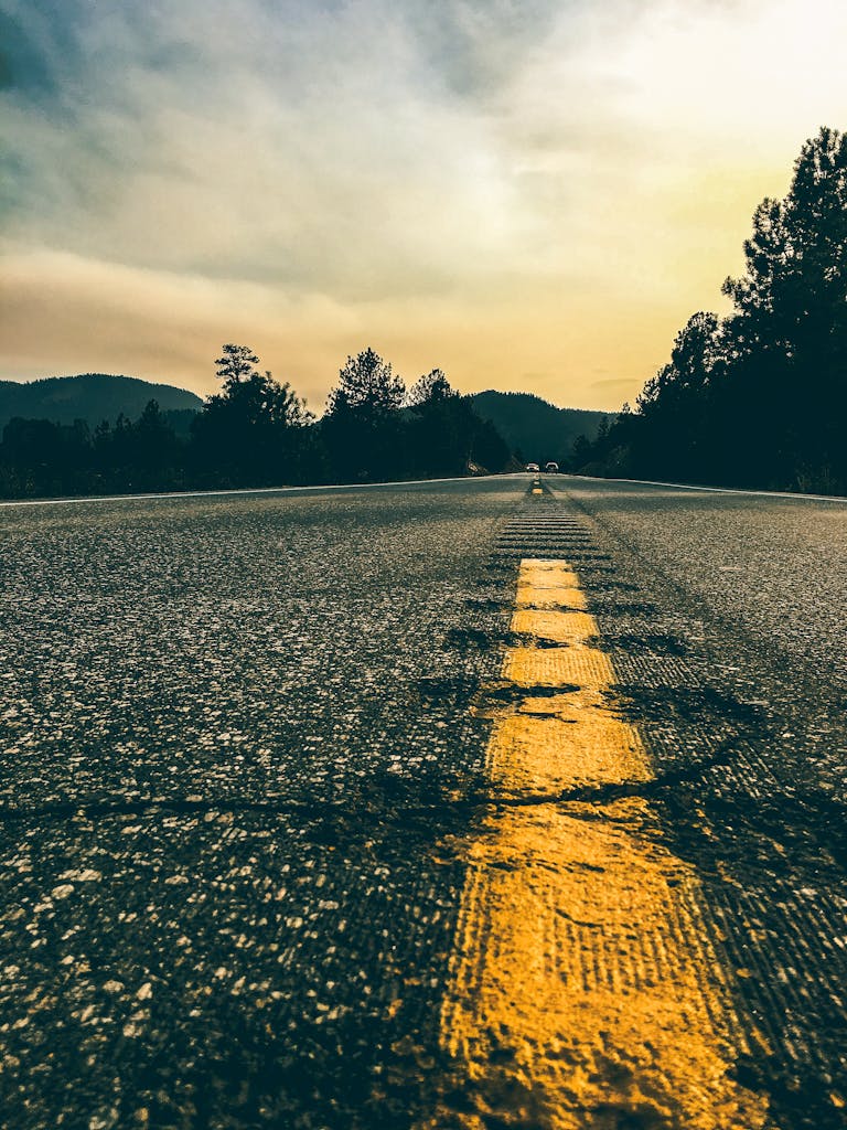 A striking road view in Golden, Colorado, captured at sunset with vivid colors and scenic mountains.